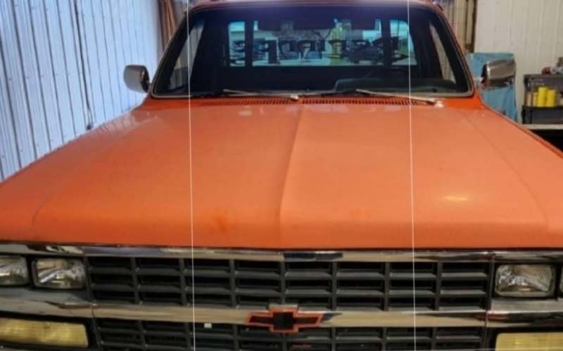 orange truck with faded paint